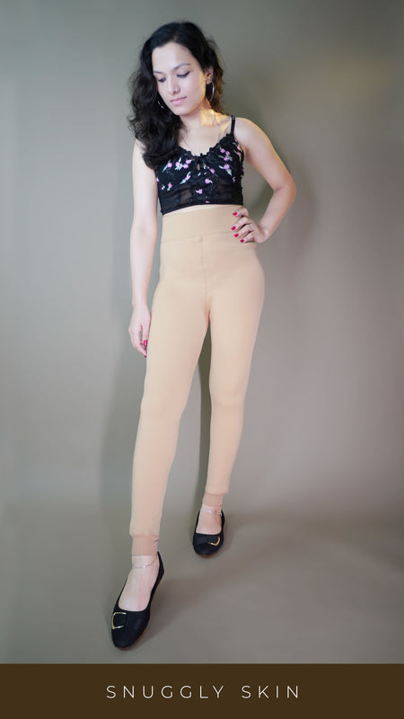 A stylish model, wearing furry skin-colored warm tights, highlighting their soft, fluffy texture that provides both warmth and comfort. -Muselot