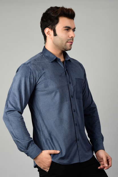 Side view of a model wearing a blue patterned shirt,highlighting the shirt's stylish and formal look-Muselot