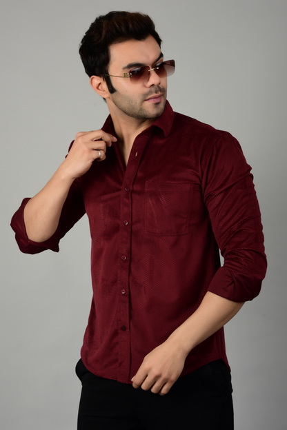 A model posing wearing a maroon shirt, highlighting the durability and stylish appearance of the shirt -Muselot