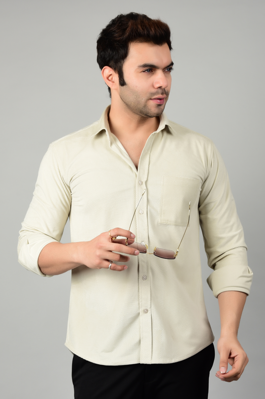 A side view of a butter cream shirt paired with a black pant,model posing in highlighting the stylish appearance of the shirt-Muselot
