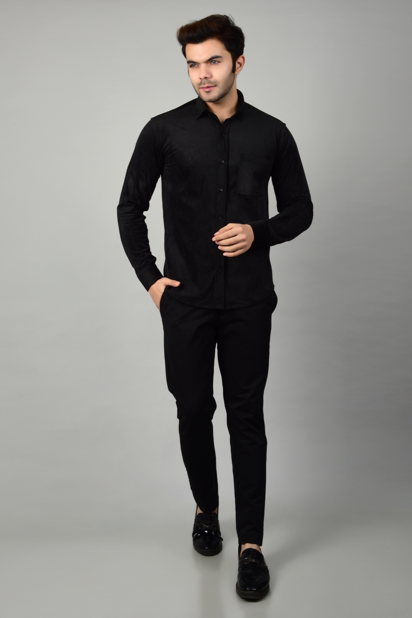 Black shirt and black pants,showcasing a formal look-Muselot