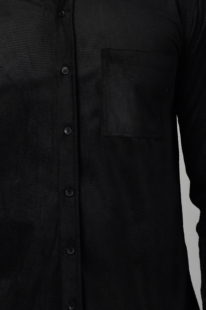 A close up view of black shirt, showcasing the velvety texture and smooth fabric-Muselot