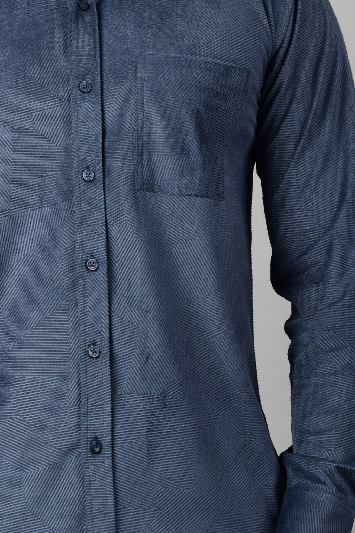 Close-up view of a blue patterned shirt, highlighting the intricate texture, emphasizing the shirt's modern style-Muselot