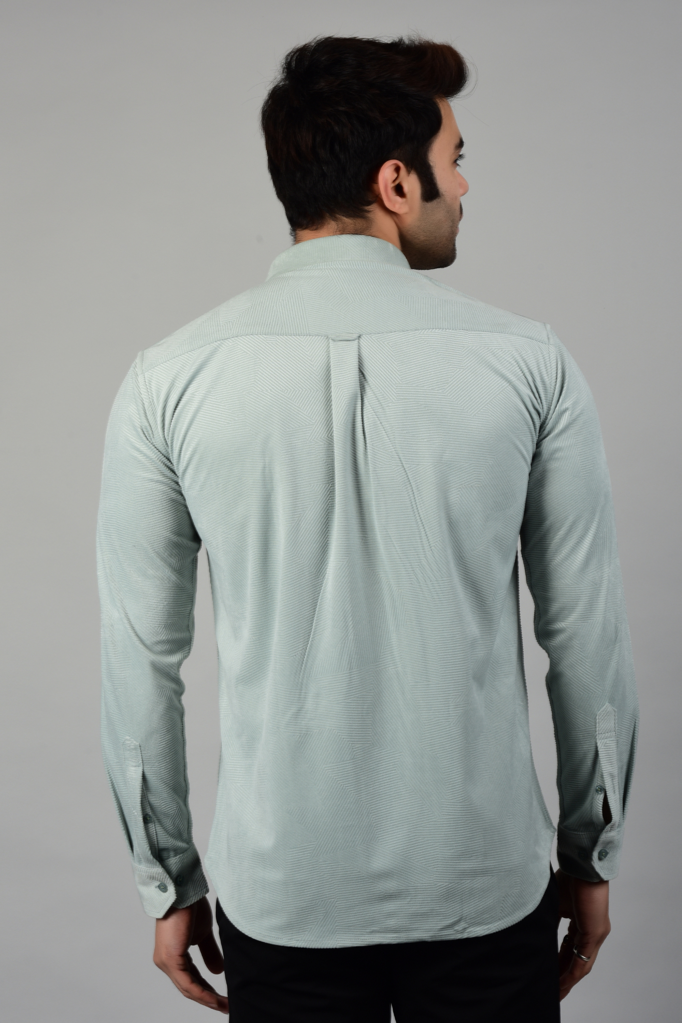 A back view of sky blue shirt, showcasing the patterns and texture of the shirt-Muselot