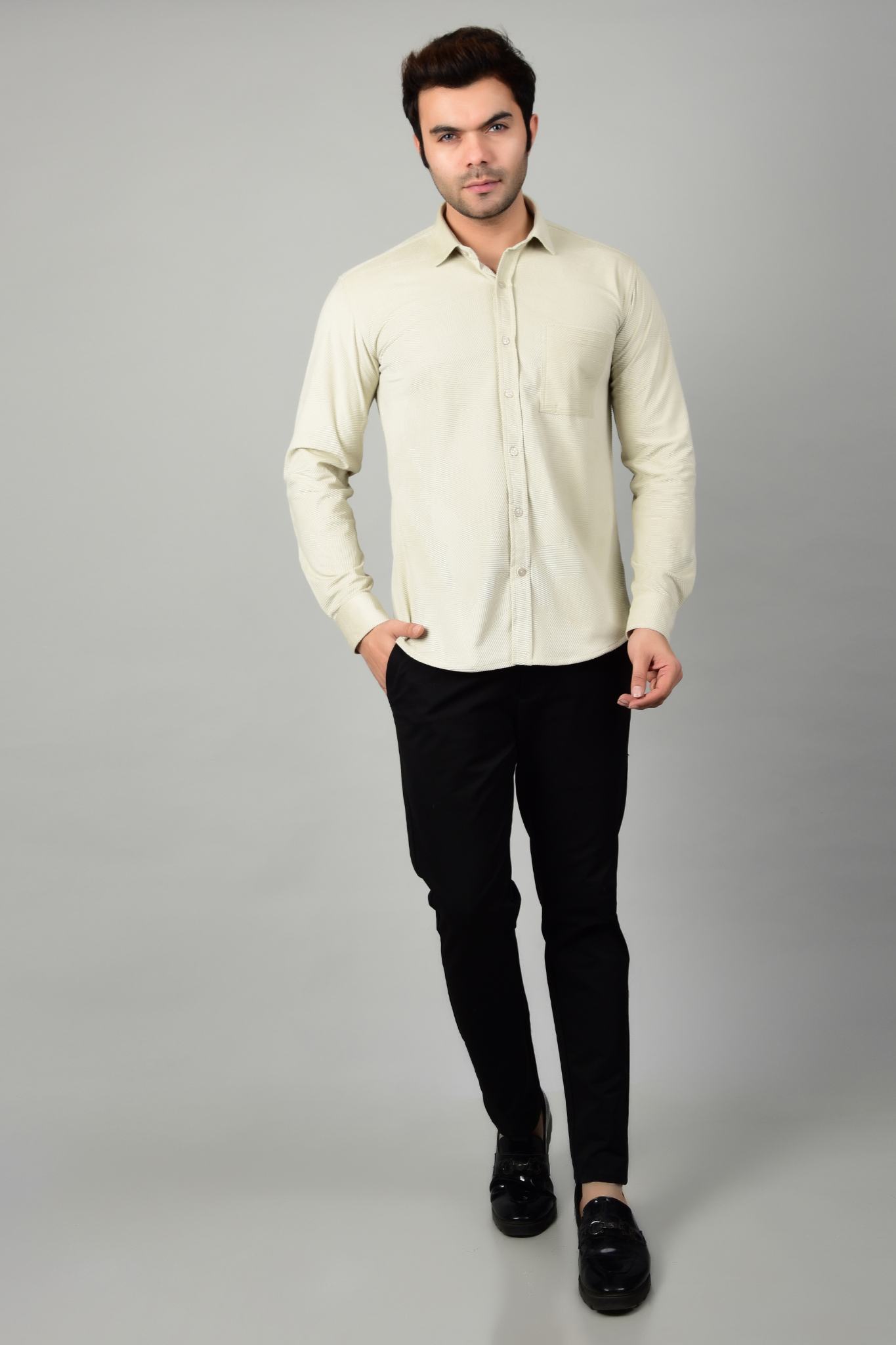 A model paired the cream shirt with a blank pant, highlighting the formal and stylish appearance of the shirt-Muselot