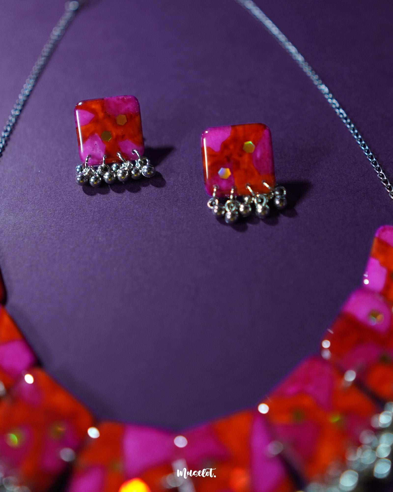 Aynoor pink floral jewelry set, beautifully showcased against a soft backdrop, with detailed pink floral accents and intricate design that exude a sense of delicate elegance and timeless charm — Muselot.