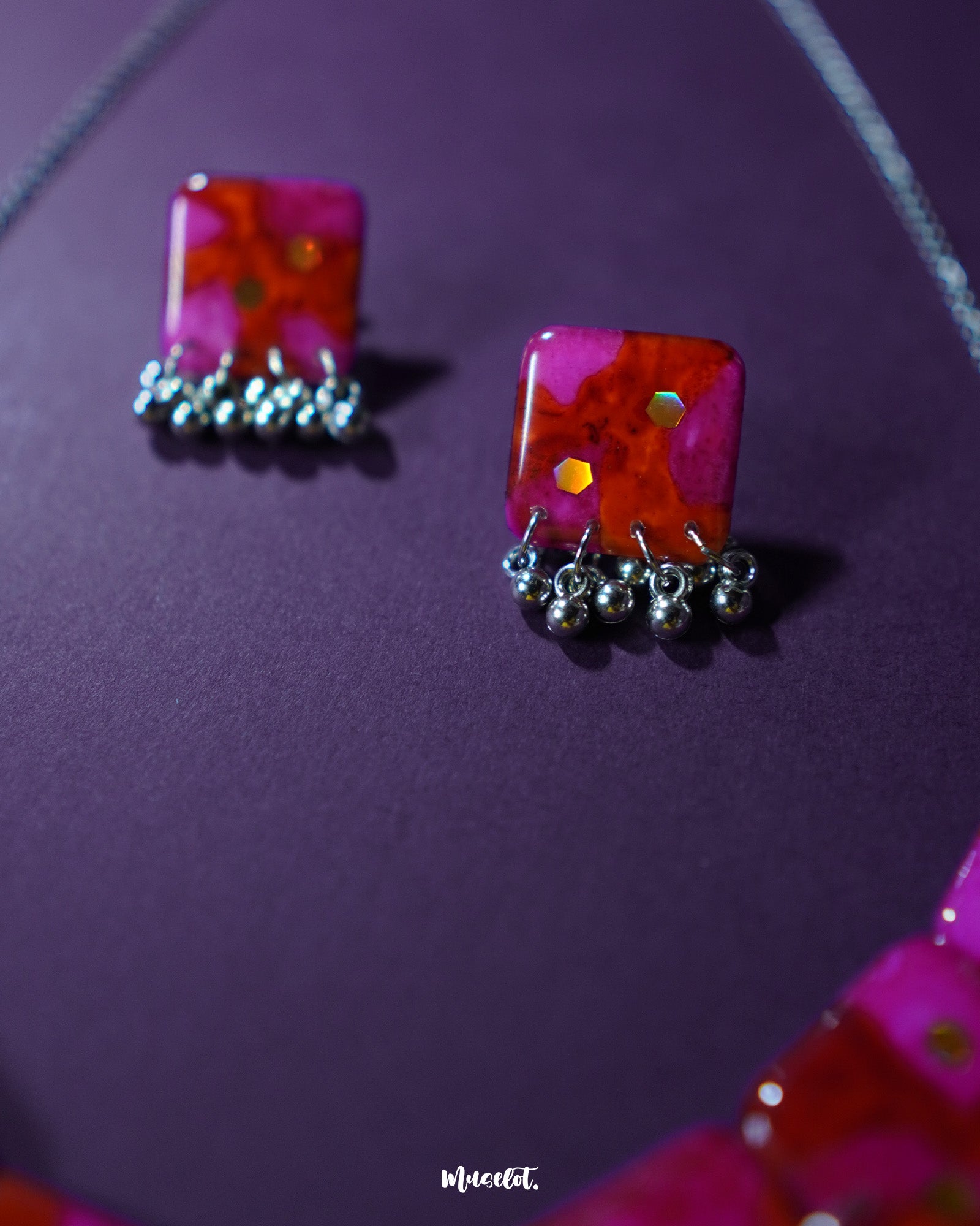 Aynoor pink floral jewelry set, elegantly displayed against a subtle background, with soft pink floral patterns and fine detailing that enhance the set's graceful and feminine appeal — Muselot.