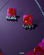 Aynoor pink floral jewelry set, elegantly displayed against a subtle background, with soft pink floral patterns and fine detailing that enhance the set's graceful and feminine appeal — Muselot.