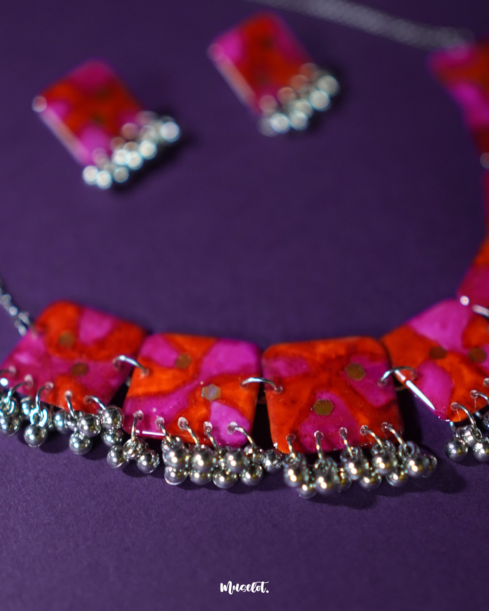 Aynoor pink floral jewelry set, showcased against a soft, neutral background, featuring delicate pink floral accents and intricate craftsmanship that elevate the set's timeless elegance and charm — Muselot.