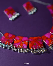 Aynoor pink floral jewelry set, showcased against a soft, neutral background, featuring delicate pink floral accents and intricate craftsmanship that elevate the set's timeless elegance and charm — Muselot.