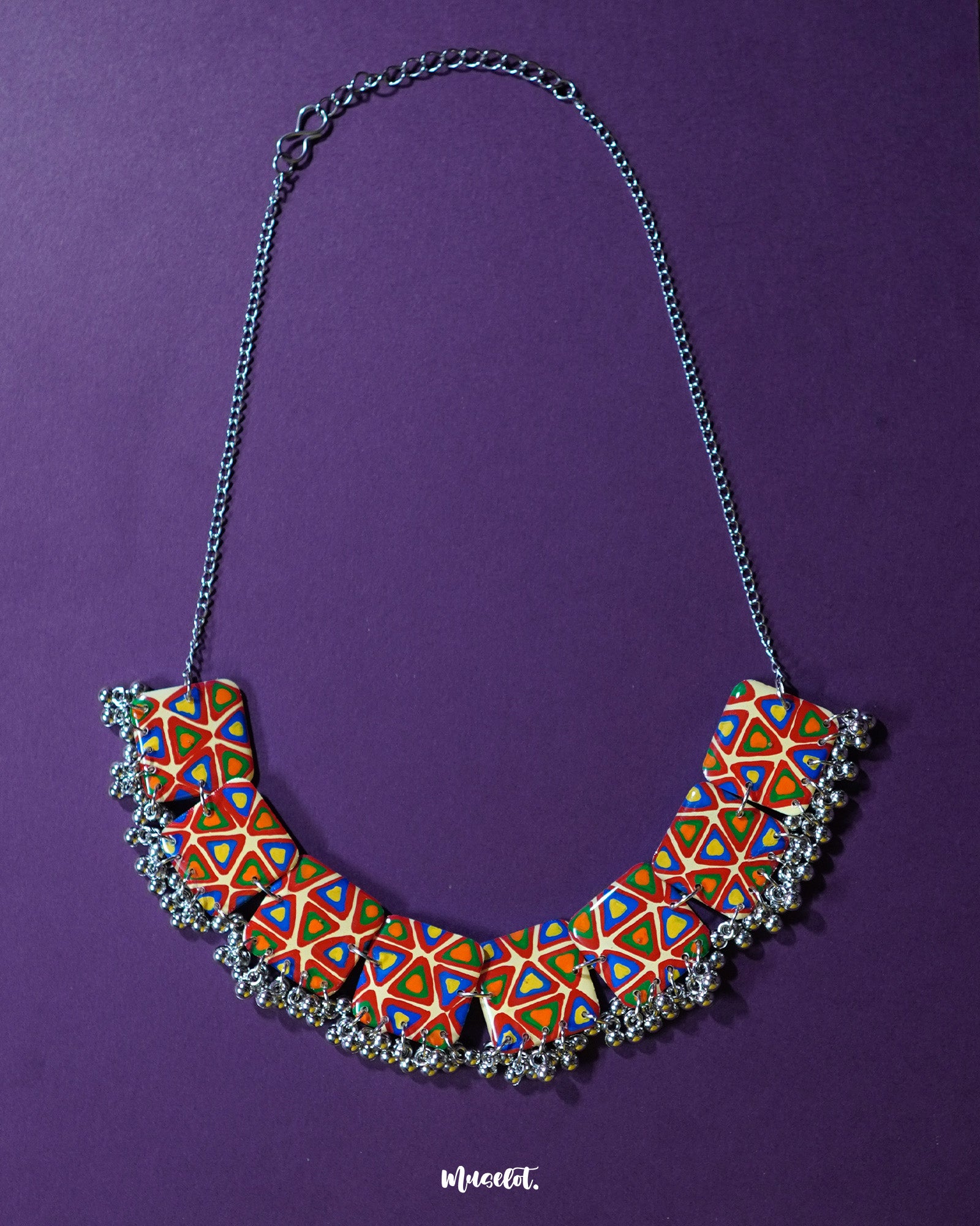 Bandhani handmade necklace, set against a soft backdrop, featuring intricate Bandhani patterns and vibrant colors that bring out a traditional yet elegant charm — Muselot.