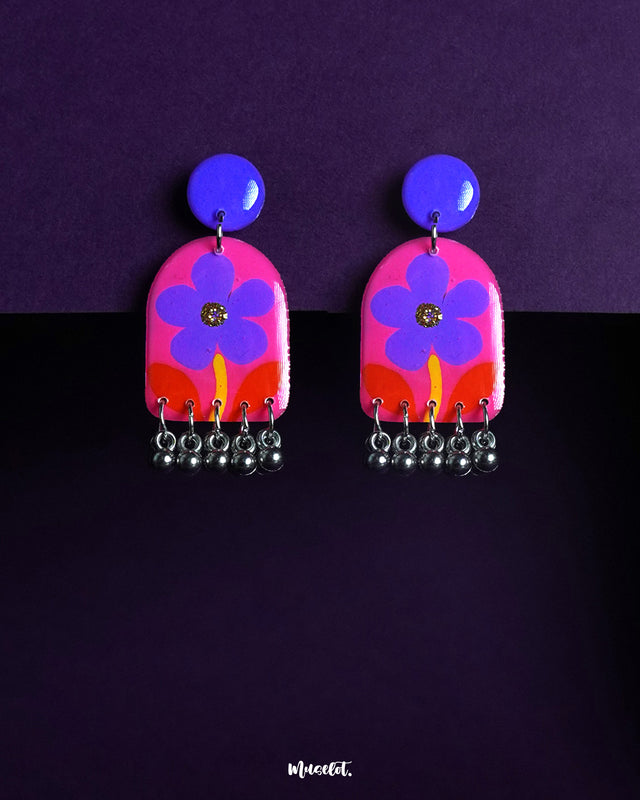 Benazir handmade floral drop earrings, showcased against a soft backdrop, featuring delicately hand-painted petals in warm hues, embodying artisanal elegance and lightweight comfort — Muselot.