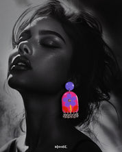 Benazir handmade floral drop earrings worn by the model, featuring intricate floral detailing in warm tones with a graceful dangling design that adds an artisanal touch to the overall look — Muselot