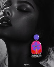 Close-up of the Benazir handmade floral drop earrings worn by the model, highlighting the delicate petal textures and soft, that lend a refined charm to the handcrafted design — Muselot