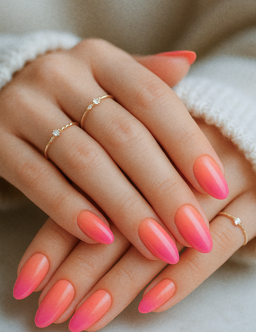 A styled shot of a model’s hands wearing Berry Bliss Ombre nail stickies, showcasing the seamless gradient blending from coral-pink to a rich berry tone across all nails, highlighting the elegance of coordinated ombre nail art with a glossy, salon-like finish – Muselot.