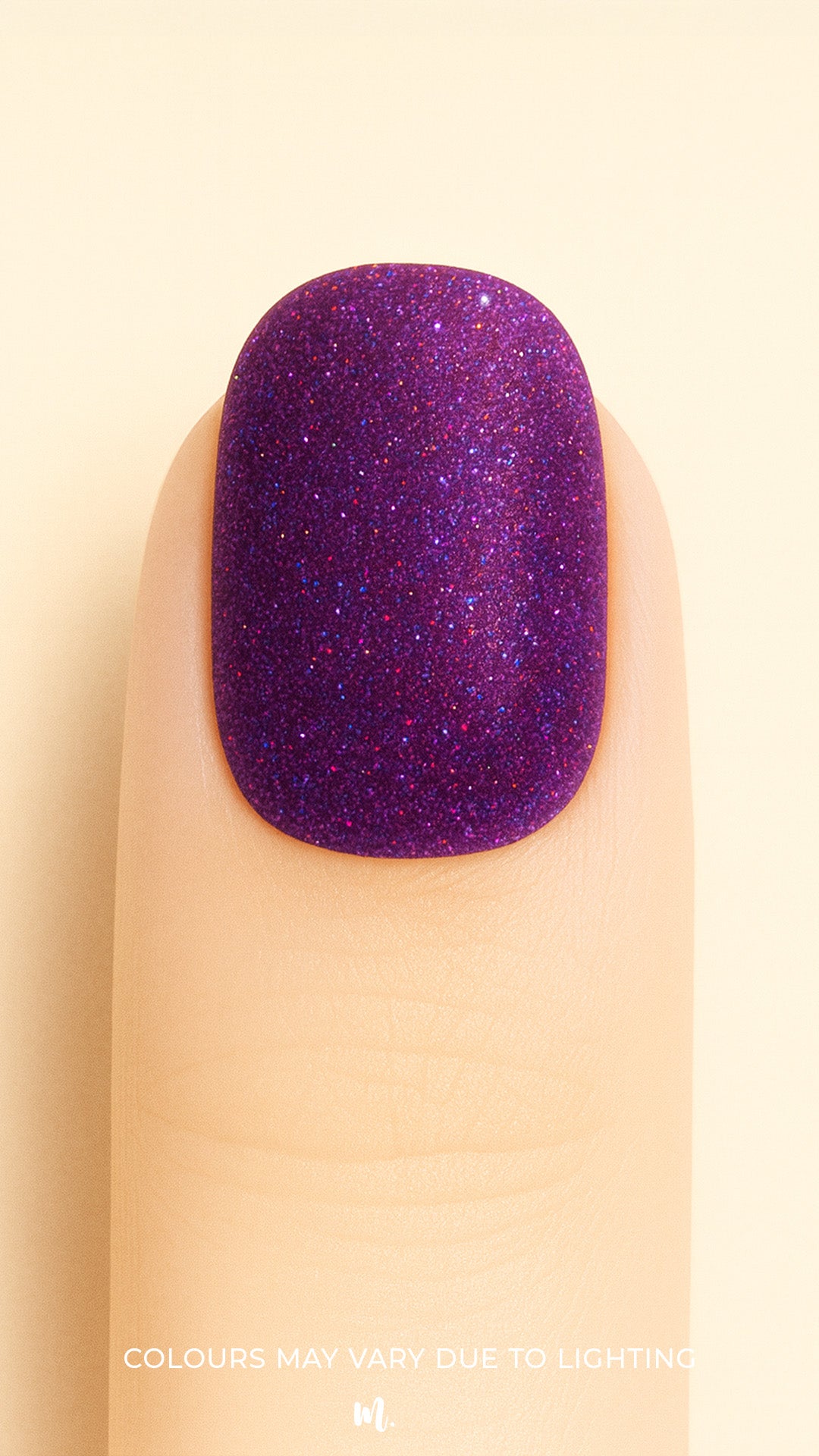 A close-up shot of a model’s finger wearing Berry Cosmos Glitter nail stickies, showcasing a deep purple base filled with fine multicolor glitter specks in pink, blue, and violet. The design highlights the cosmic sparkle and glossy galaxy-like finish that makes this glitter nail art stand out – Muselot.