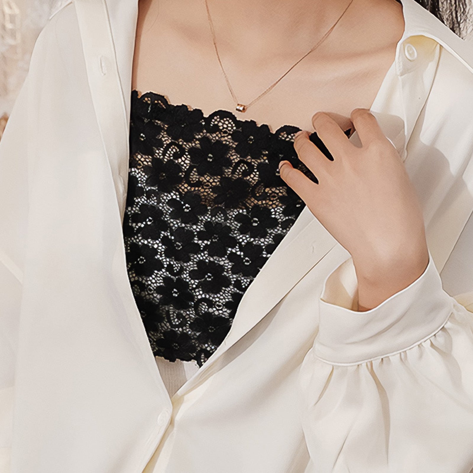 A woman wearing a black lacy mocker featuring delicate lace detailing, adding a subtle statement to her outfit with its elegant and refined finish — Muselot.