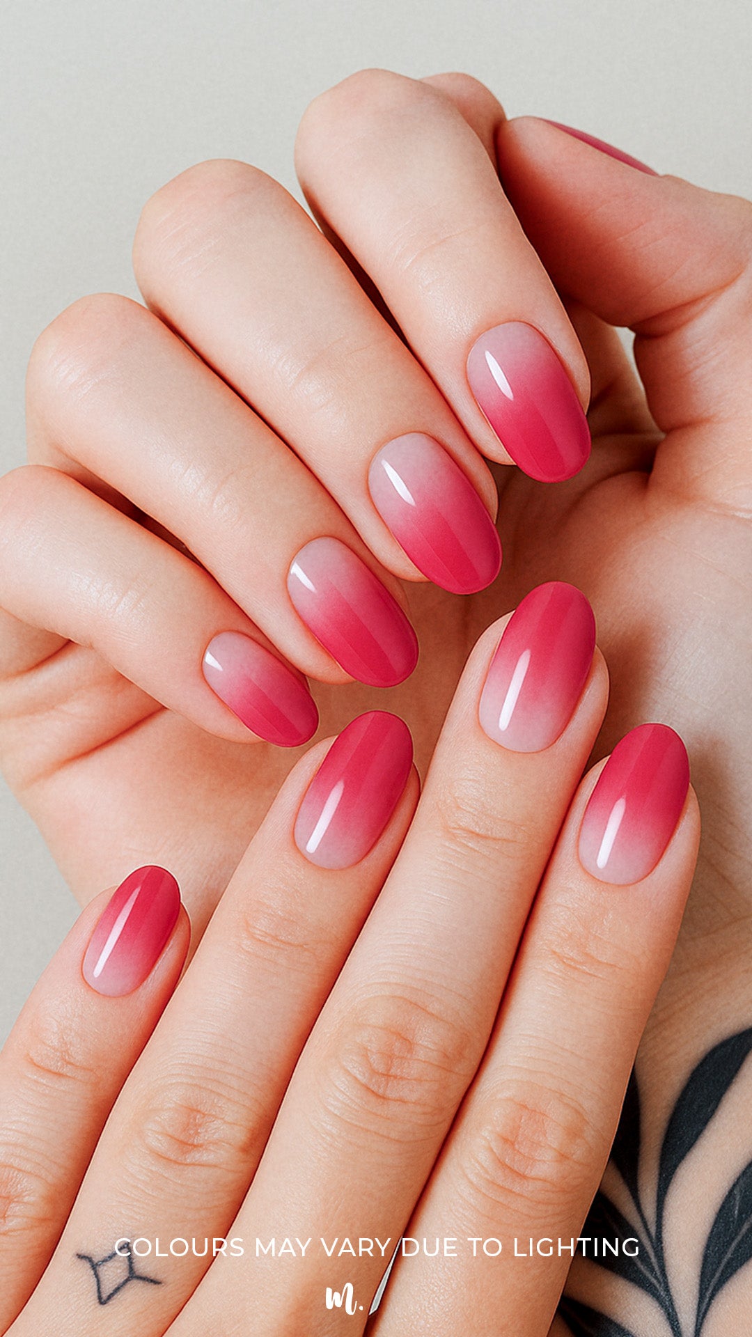 A model hand styled with Blush Mist Pink Ombre Nail Polish Stickies, featuring a seamless transition from soft blush pink at the base to a deeper rose-red tip, highlighting a glossy and elegant gradient finish that feels both subtle and striking – Muselot.