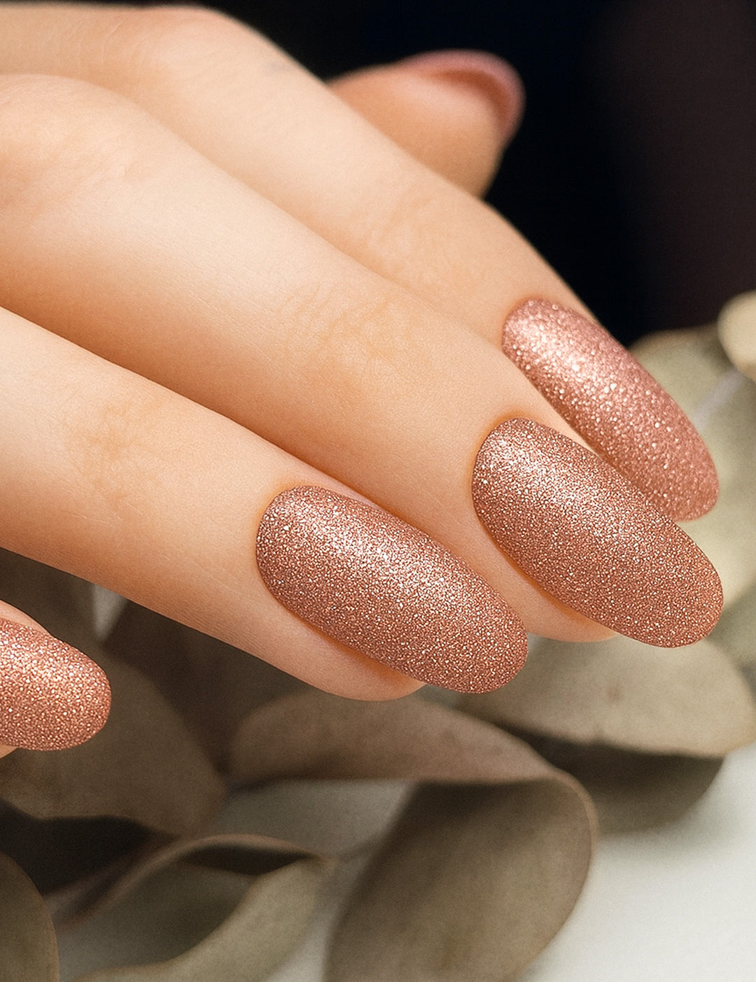 A close-up image of Caramel Glow Glitter nail art stickies, showcasing the warm caramel-brown shade with sparkling glitter accents, highlighting the glossy shine and effortless charm of simple glitter nail art for a salon-style finish – Muselot.