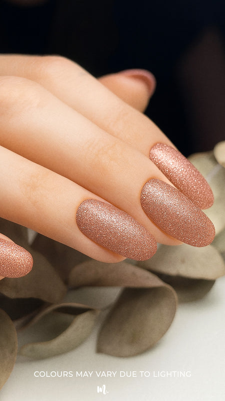 A close-up image of Caramel Glow Glitter nail art stickies, showcasing the warm caramel-brown shade with sparkling glitter accents, highlighting the glossy shine and effortless charm of simple glitter nail art for a salon-style finish – Muselot.