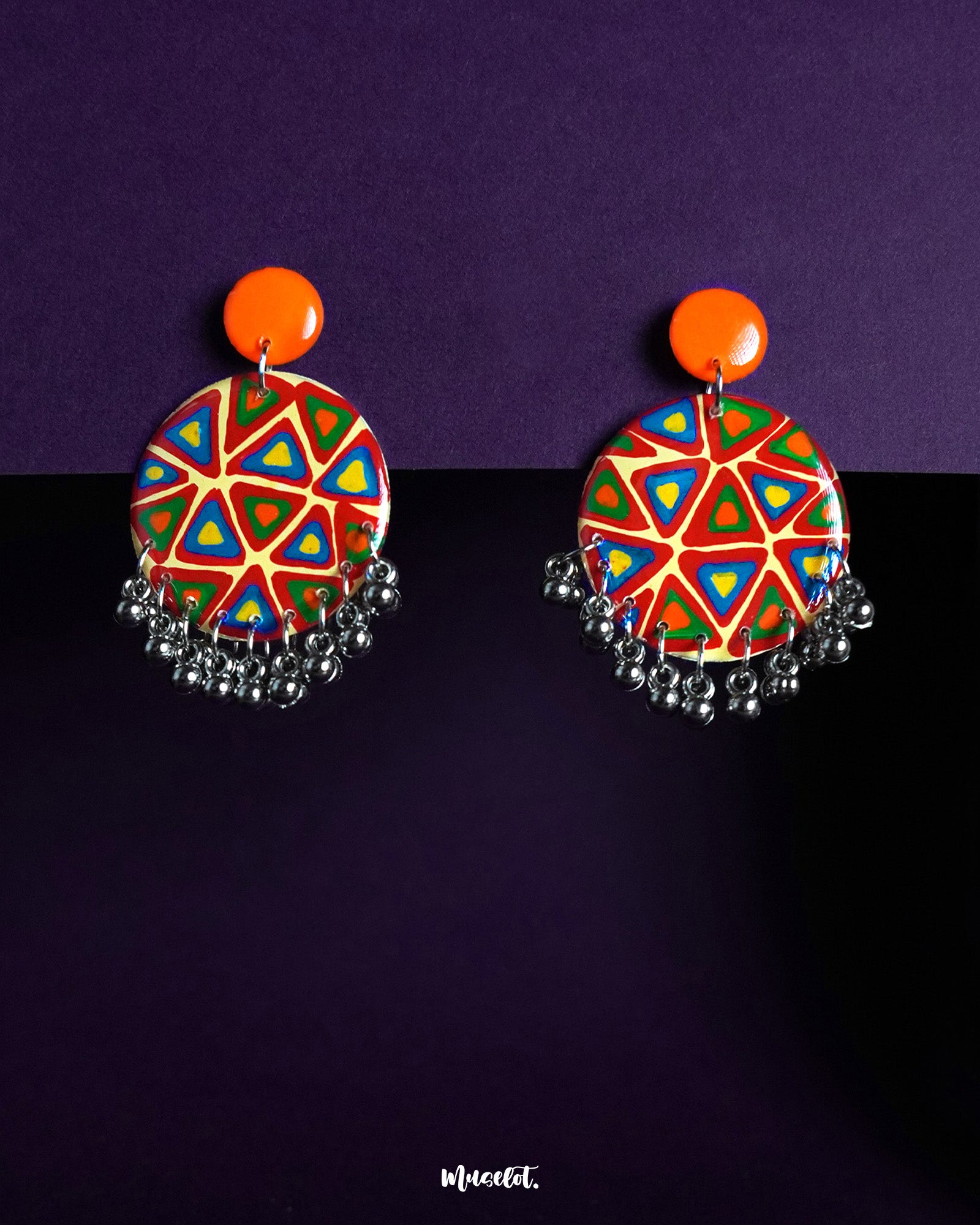 Chakardi traditional art earrings, set against a soft backdrop, showcasing intricate designs inspired by traditional craftsmanship, blending heritage with elegance for a timeless look — Muselot.