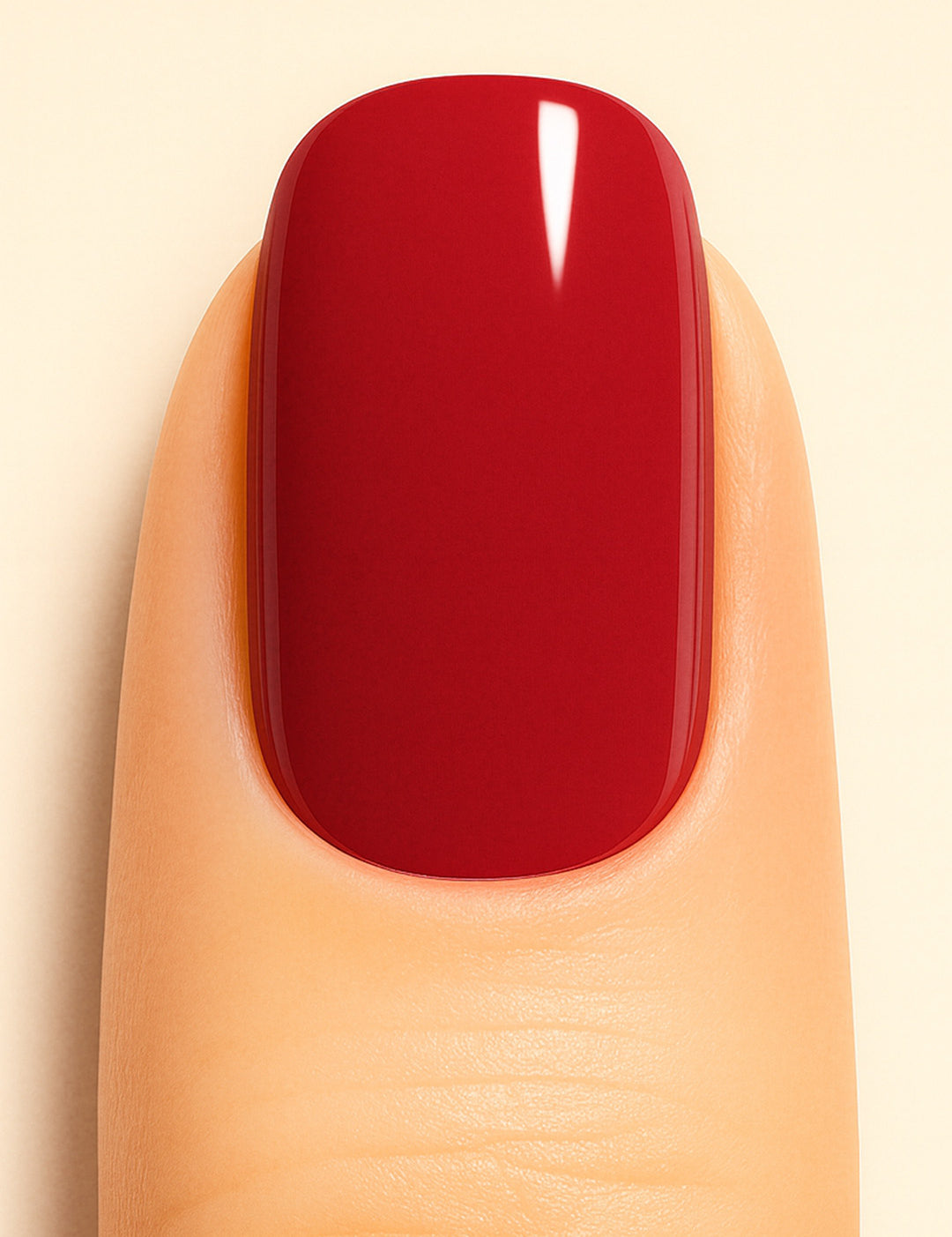 A close-up shot of a model’s finger wearing Crimson Kiss Solid Nail Stickies, showcasing a deep, bold crimson red shade with a smooth glossy finish, highlighting the rich solid color and sleek shine of the nail art – Muselot.