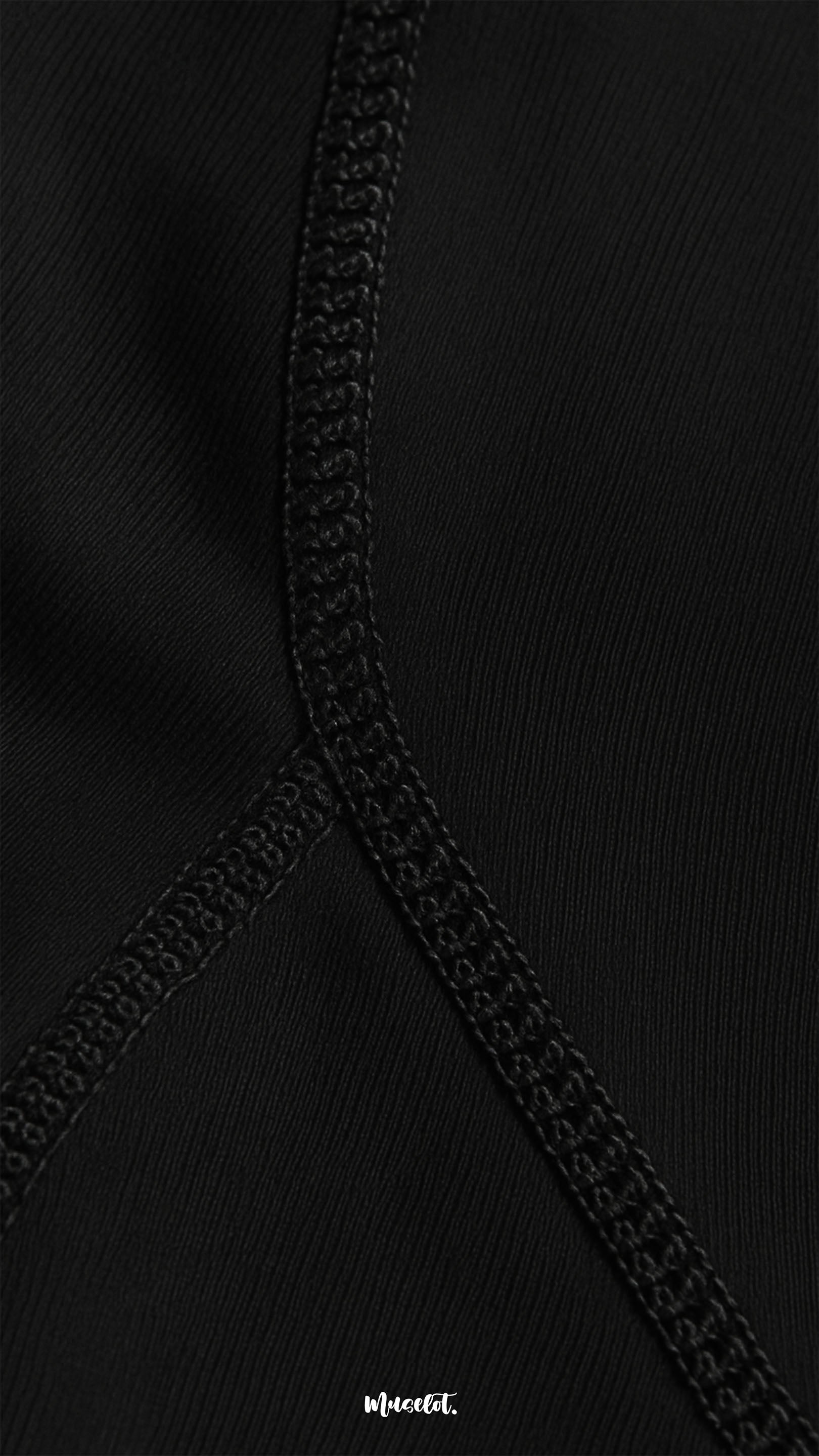 Close-up of comfortable opaque black stockings with reinforced seam, highlighting premium stitching, durability, and smooth fabric texture - Muselot