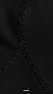 Close-up of comfortable opaque black stockings with reinforced seam, highlighting premium stitching, durability, and smooth fabric texture - Muselot