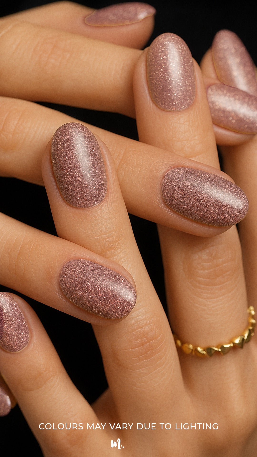 A shot of model hands wearing Dusty Rose Glitter nail stickies, showcasing the soft rose-pink shade filled with fine glitter sparkles, highlighting the shimmer and elegance of minimal nail art in a glossy salon-style finish – Muselot.