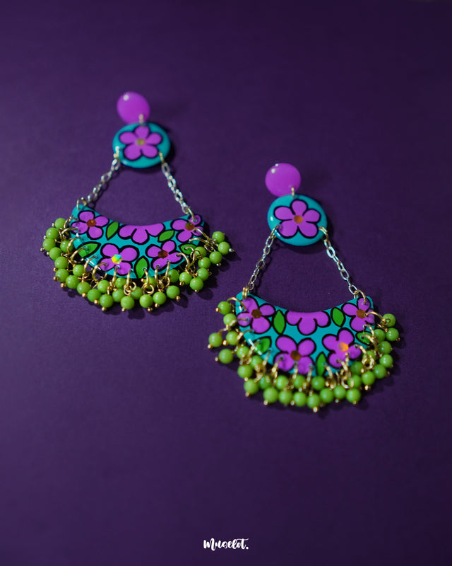 Gulbahaar chandbali earrings with vivid purple and green floral hand-painted patterns, finished with dangling yellow beads, highlighting their bold handcrafted appeal — Muselot.