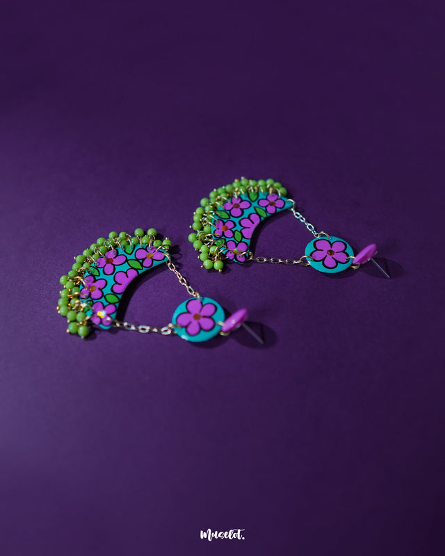 Gulbahaar chandbali earrings with a crescent shape adorned in pastel floral hand-painting and small dangling yellow beads, highlighting artistic elegance and showcasing delicate craftsmanship — Muselot.