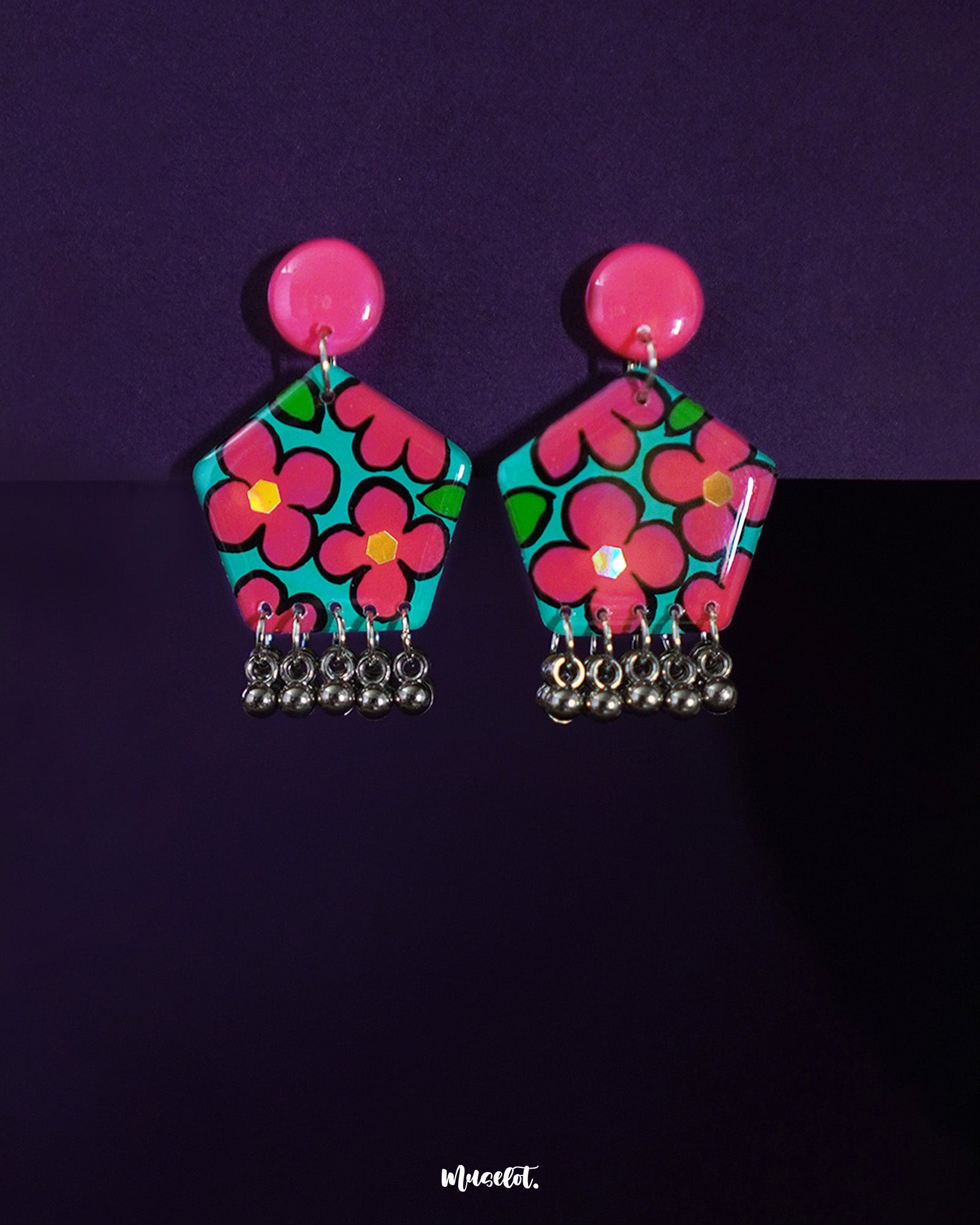 Gulshafa boho floral stud earrings, delicately placed against a soft, neutral backdrop, with intricate floral details and earthy tones that capture the essence of bohemian elegance — Muselot.