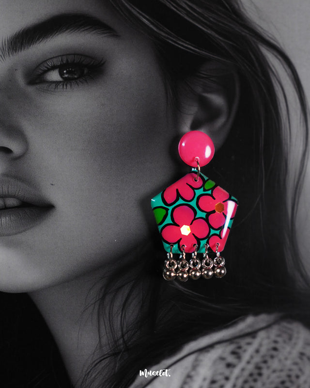 a model wearing Gulshafa floral stud earrings, with intricate floral designs and soft earthy tones that perfectly complement a boho-chic style — Muselot.