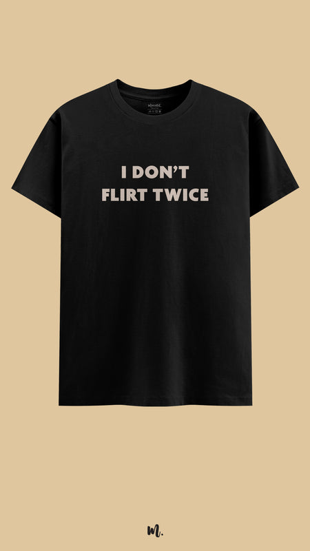 Black graphic t-shirt showcasing the “I Don’t Flirt Twice” statement, confidently showcased against a clean, minimal beige background – Muselot