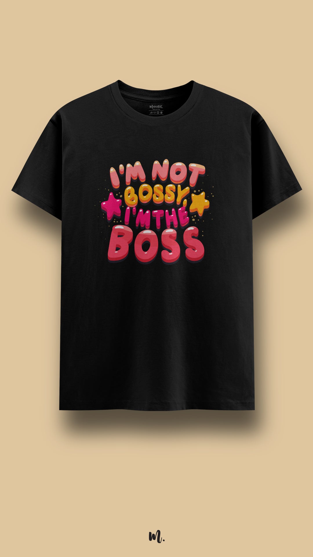 Black graphic t-shirt showcasing the “I’m Not Bossy I’m The Boss” statement, highlighting a strong, self-assured personality with bright, eye-catching design elements against a clean beige background – Muselot