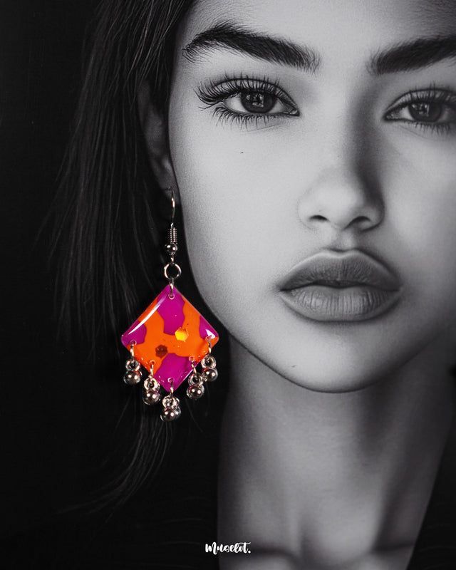 The model wearing the Laalsavera abstract hook earrings, highlighting the artistic curves and unique design that add a modern edge to traditional charm – Muselot