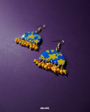 Mahrosh floral hook earrings, displayed against a soft background, with intricate floral detailing and a delicate design that brings out a perfect balance of elegance and natural beauty — Muselot.