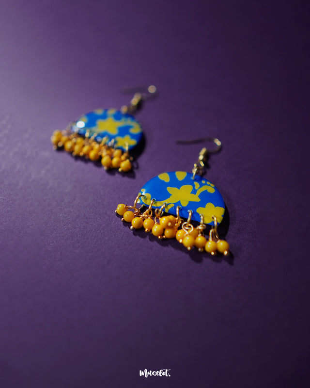Mahrosh floral hook earrings, displayed against a soft background, with intricate floral detailing and a delicate design that brings out a perfect balance of elegance and natural beauty — Muselot.