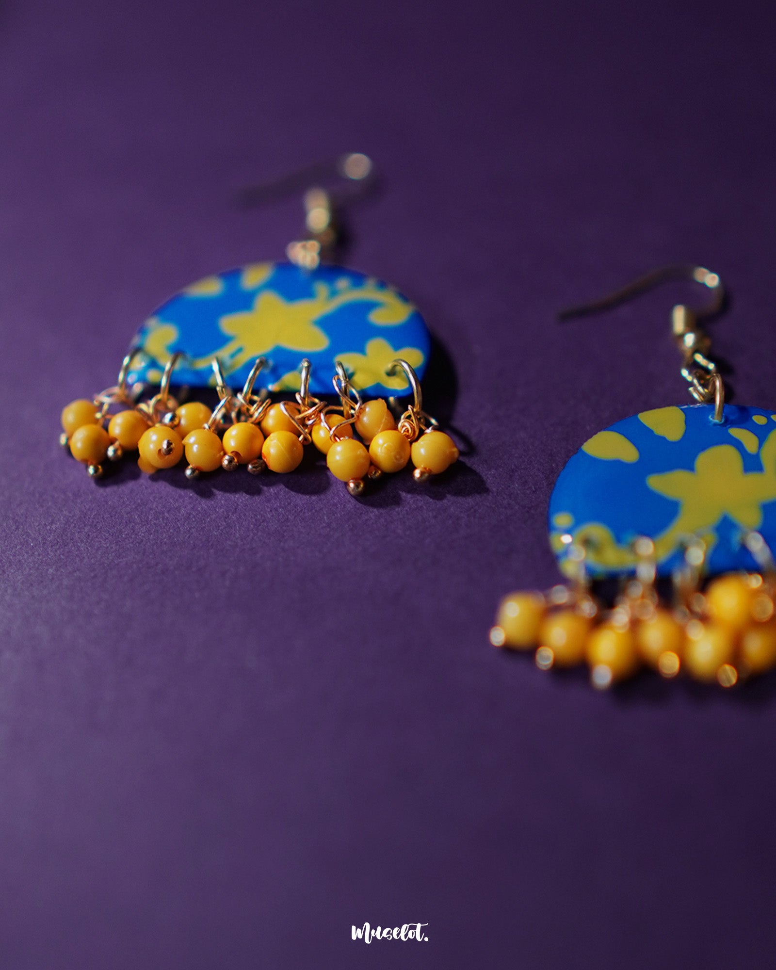 Mahrosh floral hook earrings, displayed against a soft backdrop, showcasing exquisite floral motifs and fine craftsmanship that highlight their refined elegance and natural beauty — Muselot.
