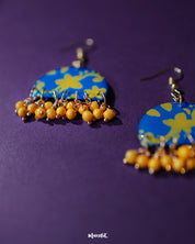 Mahrosh floral hook earrings, displayed against a soft backdrop, showcasing exquisite floral motifs and fine craftsmanship that highlight their refined elegance and natural beauty — Muselot.
