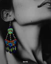 Close-up shot of a model wearing Mayoori chandbali earrings, featuring delicate detailing and a traditional design that enhance the elegance of the overall look with a timeless, sophisticated touch — Muselot.