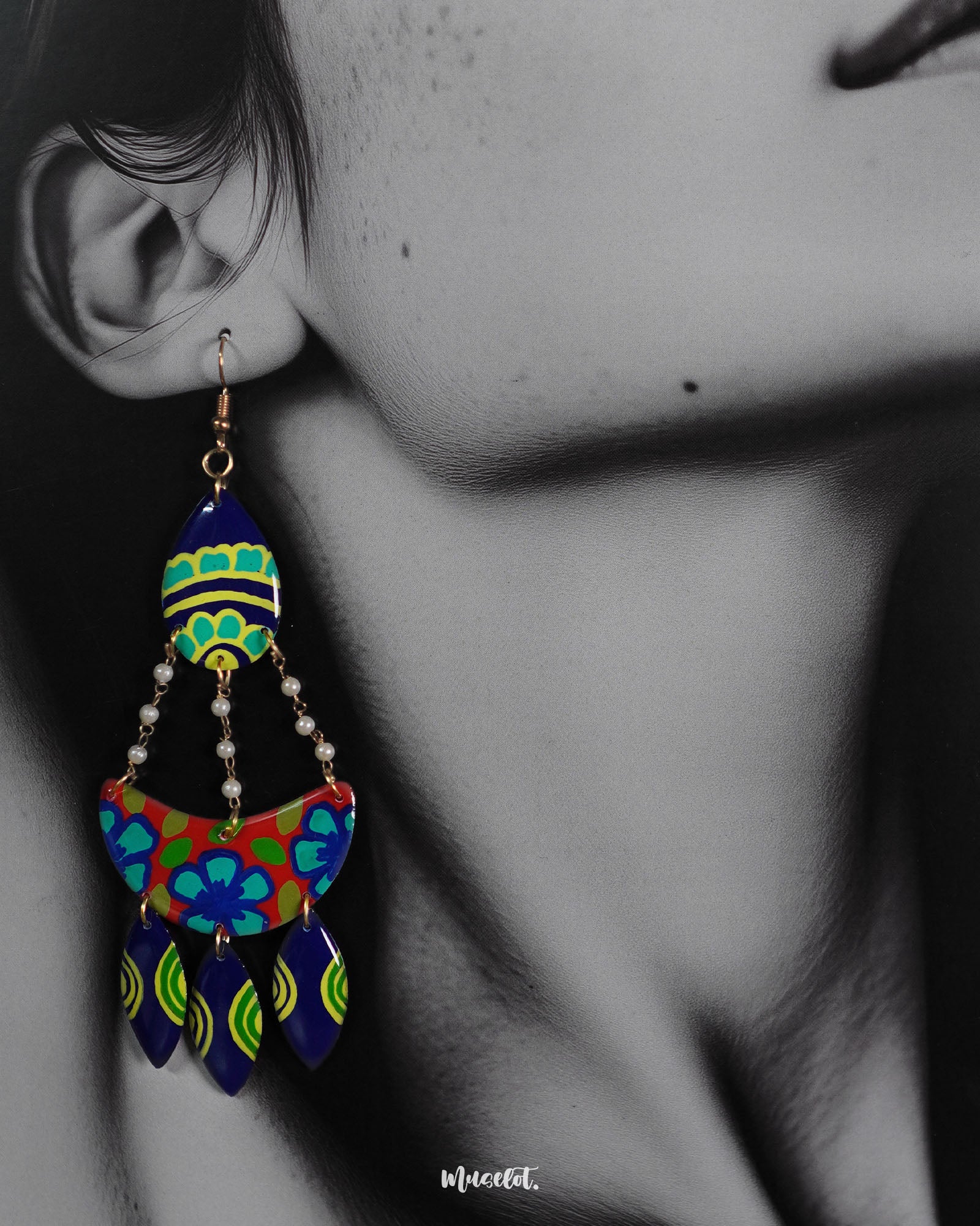 A model wearing Mayoori chandbali earrings, with intricate patterns and bold design elements that bring out their regal charm and timeless elegance — Muselot.