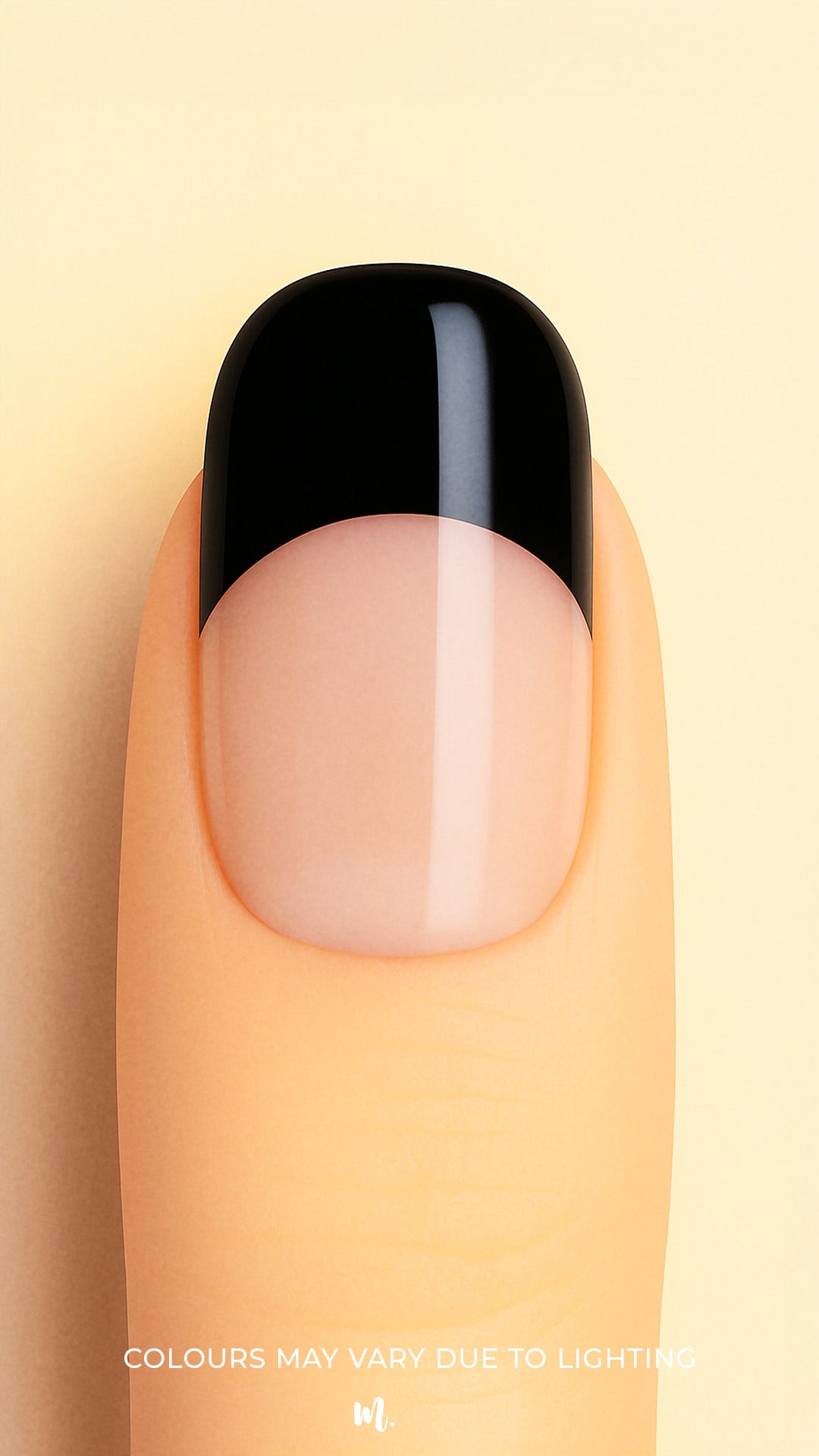 A close-up view of a finger wearing Midnight Tiara French Tip nail stickies, featuring a sleek black tip over a glossy nude base. The design highlights the timeless elegance of the French manicure with a bold, modern twist, giving a chic and sophisticated finish – Muselot.
