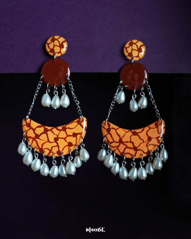 Mittika chandbali earrings featuring earthy tones and abstract crackle patterns, finished with delicate pearl drops — a bold yet graceful piece for statement styling — Muselot.