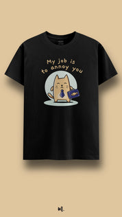 Black graphic t-shirt showcasing a cute cat illustration with the “My Job Is to Annoy You” statement, highlighting a quirky, humorous personality against a clean beige background – Muselot