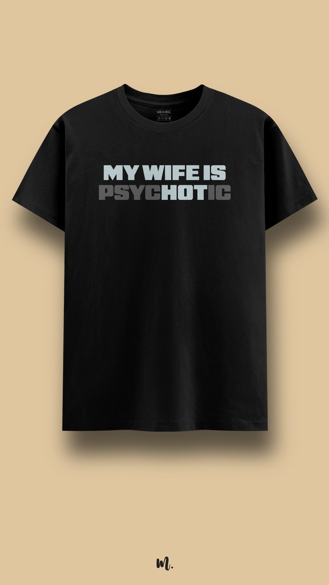 Black graphic t-shirt showcasing the statement “MY WIFE IS PSYCHOTIC” in strong block typography with contrast shading, highlighting a loud, sarcastic, and attention-grabbing relationship joke against a clean beige background – Muselot