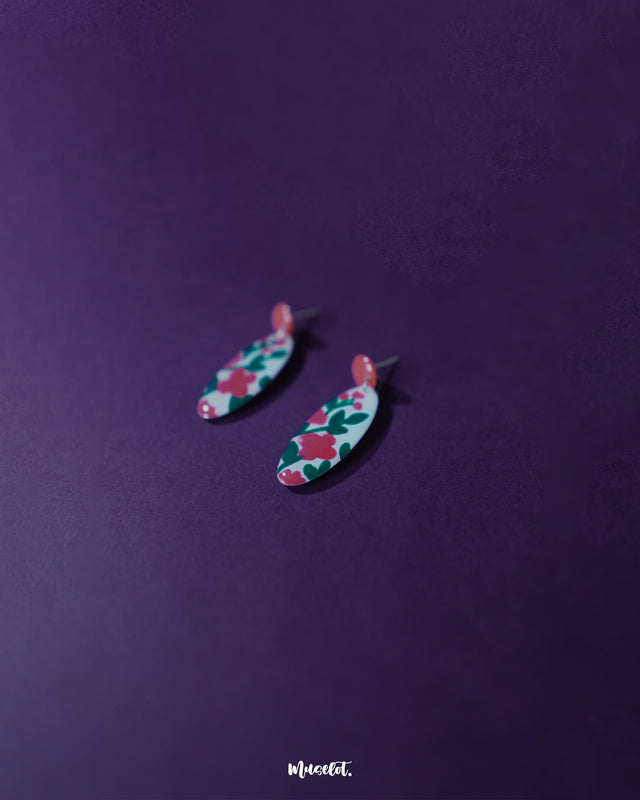 Nargis pink floral drop earrings showing detailed floral artwork in pink and green on a white background, highlighting the intricate enamel work and handmade craftsmanship — Muselot.