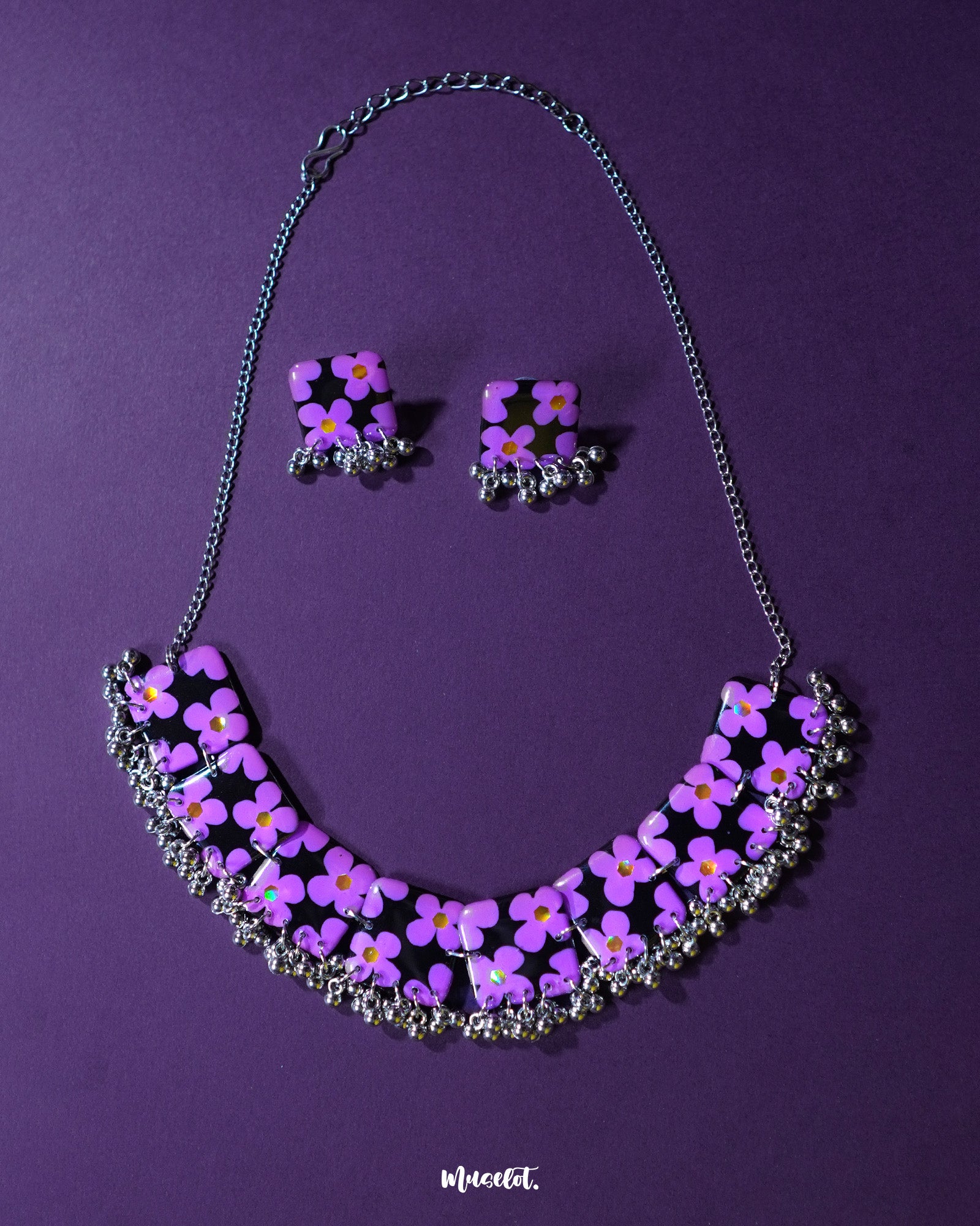 Naubahar purple necklace set adorned with delicate lavender flowers, set against a soft purple background, exuding an elegant blend of charm and sophistication — Muselot