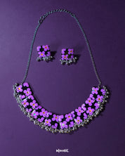Naubahar purple necklace set adorned with delicate lavender flowers, set against a soft purple background, exuding an elegant blend of charm and sophistication — Muselot
