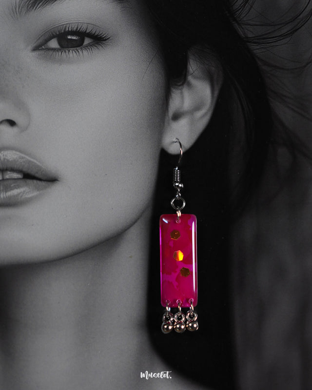A model flaunting the Noorasa drop earrings, highlighting their graceful charm and adding a statement touch to the look – Muselot